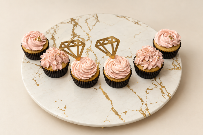 Pink cupcakes with gold toppers studio edit